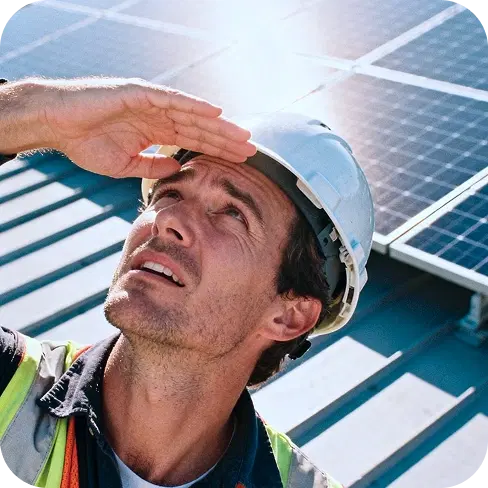 Solar panel installer checking alignment
